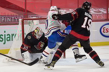 Feb 23, 2021; Ottawa, Ontario, CAN; Ottawa Senators goalie Matt Murray (30) makes a save in front of Montreal Canadiens left wing Tomas Tatar (90) in the first period at the Canadian Tire Centre. Mandatory Credit: Marc DesRosiers-USA TODAY Sports