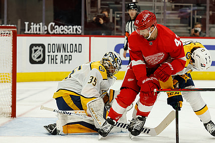 Feb 23, 2021; Detroit, Michigan, USA;  Nashville Predators goaltender Pekka Rinne (35) makes the save ion Detroit Red Wings left wing Darren Helm (43) in the second period  at Little Caesars Arena. Mandatory Credit: Rick Osentoski-USA TODAY Sports