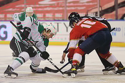 Feb 24, 2021; Sunrise, Florida, USA; Dallas Stars Rhett Gardner (49) and Florida Panthers center Aleksander Barkov (16) face-off during the first period at BB&T Center. Mandatory Credit: Sam Navarro-USA TODAY Sports
