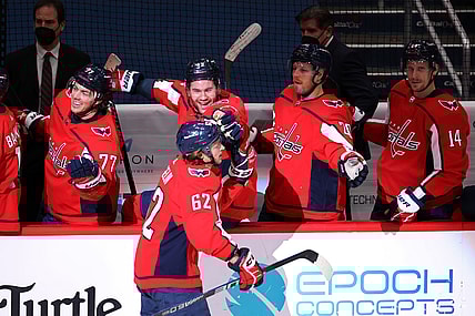 Feb 25, 2021; Washington, District of Columbia, USA; Washington Capitals left wing Carl Hagelin (62) celebrates with teammates after scoring an empty net goal against the Pittsburgh Penguins in the third period at Capital One Arena. Mandatory Credit: Geoff Burke-USA TODAY Sports