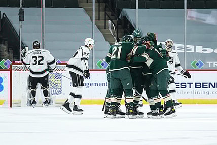 Feb 26, 2021; Saint Paul, Minnesota, USA; The Minnesota Wild celebrate after center Joel Eriksson Ek (14) scored a goal against Los Angeles Kings goaltender Jonathan Quick (32) in the first period at Xcel Energy Center. Mandatory Credit: David Berding-USA TODAY Sports