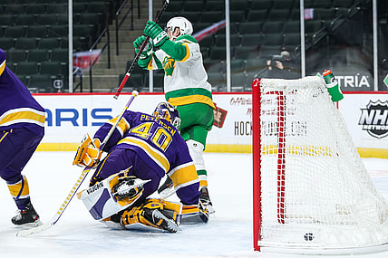 Feb 27, 2021; Saint Paul, Minnesota, USA; Minnesota Wild center Nico Sturm (7) celebrates after scoring a goal against Los Angeles Kings goaltender Calvin Petersen (40) in the first period at Xcel Energy Center. Mandatory Credit: David Berding-USA TODAY Sports