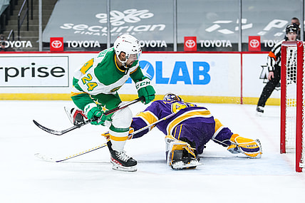 Feb 27, 2021; Saint Paul, Minnesota, USA; Minnesota Wild defenseman Matt Dumba (24) scores a goal against Los Angeles Kings goaltender Calvin Petersen (40) in overtime at Xcel Energy Center. Mandatory Credit: David Berding-USA TODAY Sports