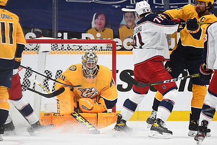 Feb 28, 2021; Nashville, Tennessee, USA; Nashville Predators goaltender Juuse Saros (74) makes a save during the first period against the Columbus Blue Jackets at Bridgestone Arena. Mandatory Credit: Christopher Hanewinckel-USA TODAY Sports