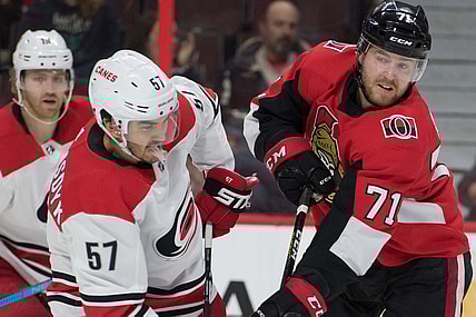 Jan 6, 2019; Ottawa, Ontario, CAN; Carolina Hurricanes defenseman Trevor Van Riemsdyk (57) battles with Ottawa Senators center Chris Tierney (71) in the second period at the Canadian Tire Centre. Mandatory Credit: Marc DesRosiers-USA TODAY Sports