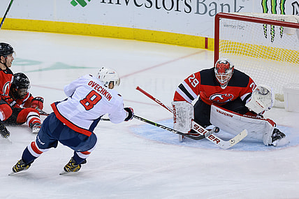Feb 28, 2021; Newark, New Jersey, USA; New Jersey Devils goaltender Mackenzie Blackwood (29) blocks a shot by Washington Capitals left wing Alex Ovechkin (8) during the first period at Prudential Center. Mandatory Credit: Vincent Carchietta-USA TODAY Sports