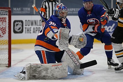 Feb 28, 2021; Uniondale, New York, USA; New York Islanders goalie Ilya Sorokin (30) makes a save against the Pittsburgh Penguins during the third period at Nassau Veterans Memorial Coliseum. Mandatory Credit: Brad Penner-USA TODAY Sports