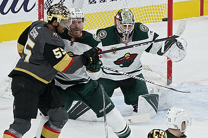 Mar 1, 2021; Las Vegas, Nevada, USA; A shot by the Vegas Golden Knights hits a goal post beside Minnesota Wild goaltender Cam Talbot (33) as Minnesota defenseman Ian Cole (28) guards Vegas right wing Keegan Kolesar (55) during the first period at T-Mobile Arena. Mandatory Credit: John Locher-POOL PHOTOS-USA TODAY Sports