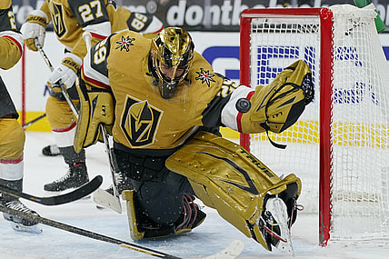 Mar 3, 2021; Las Vegas, Nevada, USA; Vegas Golden Knights goaltender Marc-Andre Fleury (29) blocks a shot by the Minnesota Wild during the first period of an NHL hockey game Wednesday, March 3, 2021, in Las Vegas.   Mandatory Credit:  John Locher-POOL PHOTOS-USA TODAY Sports