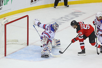 Mar 4, 2021; Newark, New Jersey, USA; New York Rangers goaltender Igor Shesterkin (31) makes a save on a shot by New Jersey Devils center Janne Kuokkanen (59) during the first period at Prudential Center. Mandatory Credit: Ed Mulholland-USA TODAY Sports