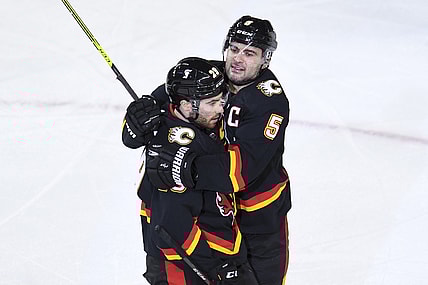 Mar 4, 2021; Calgary, Alberta, CAN; Calgary Flames forward Dillon Dube (29) celebrates his second period goal with defenseman Mark Giordano (5) against the Ottawa Senators at Scotiabank Saddledome. Mandatory Credit: Candice Ward-USA TODAY Sports