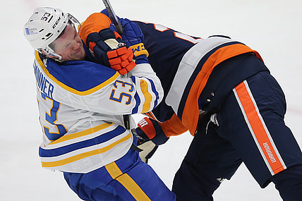 Mar 6, 2021; Uniondale, New York, USA; Buffalo Sabres left wing Jeff Skinner (53) is hit by New York Islanders defenseman Scott Mayfield (24) during the second period at Nassau Veterans Memorial Coliseum. Mandatory Credit: Brad Penner-USA TODAY Sports