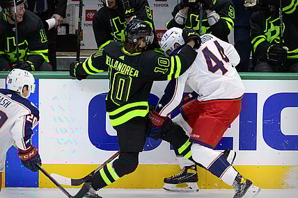 Mar 6, 2021; Dallas, Texas, USA; Dallas Stars center Ty Dellandrea (10) checks Columbus Blue Jackets defenseman Vladislav Gavrikov (44) during the first period at the American Airlines Center. Mandatory Credit: Jerome Miron-USA TODAY Sports
