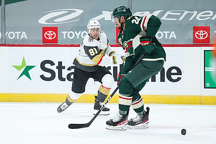 Mar 8, 2021; Saint Paul, Minnesota, USA; Vegas Golden Knights center Jonathan Marchessault (81) shoots the puck while Minnesota Wild defenseman Matt Dumba (24) defends in the first period at Xcel Energy Center. Mandatory Credit: David Berding-USA TODAY Sports