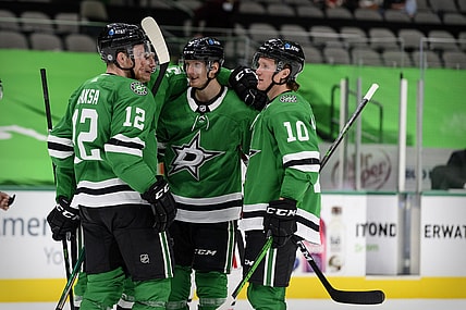 Mar 9, 2021; Dallas, Texas, USA; Dallas Stars right wing Denis Gurianov (34) and center Radek Faksa (12) and defenseman John Klingberg (3) and center Ty Dellandrea (10) celebrates a goal scored by Klingberg against the Chicago Blackhawks during the second period at the American Airlines Center. Mandatory Credit: Jerome Miron-USA TODAY Sports
