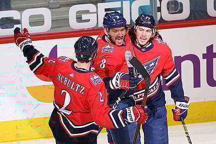 Mar 16, 2021; Washington, District of Columbia, USA; Washington Capitals left wing Alex Ovechkin (8) celebrates with teammates after scoring a goal against the New York Islanders in the second period at Capital One Arena. Ovechkin passed Phil Esposito for sixth all time on the NHL goal scoring list with the goal. Mandatory Credit: Geoff Burke-USA TODAY Sports
