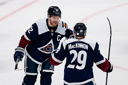 Mar 18, 2021; Denver, Colorado, USA; Colorado Avalanche left wing Gabriel Landeskog (92) celebrates his goal with center Nathan MacKinnon (29) in the first period against the Minnesota Wild at Ball Arena. Mandatory Credit: Isaiah J. Downing-USA TODAY Sports