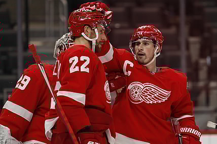 Mar 18, 2021; Detroit, Michigan, USA; Detroit Red Wings center Dylan Larkin (71) celebrates with defenseman Patrik Nemeth (22) after the game against the Dallas Stars at Little Caesars Arena. Mandatory Credit: Raj Mehta-USA TODAY Sports
