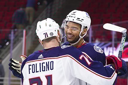 Mar 18, 2021; Raleigh, North Carolina, USA;  Columbus Blue Jackets defenseman Seth Jones (3) is congratulated by left wing Nick Foligno (71) after his game winning overtime goal against the Carolina Hurricanes at PNC Arena. Mandatory Credit: James Guillory-USA TODAY Sports