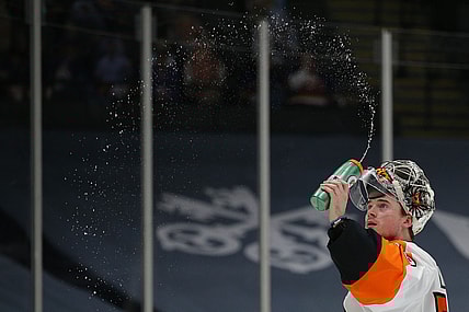 Mar 20, 2021; Uniondale, New York, USA; Philadelphia Flyers goalie Carter Hart (79) sprays water before taking a drink during the second period against the New York Islanders at Nassau Veterans Memorial Coliseum. Mandatory Credit: Brad Penner-USA TODAY Sports