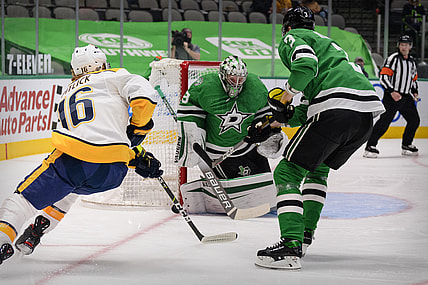 Mar 21, 2021; Dallas, Texas, USA; Dallas Stars goaltender Anton Khudobin (35) stops a shot by Nashville Predators center Rem Pitlick (16) during the first period at the American Airlines Center. Mandatory Credit: Jerome Miron-USA TODAY Sports