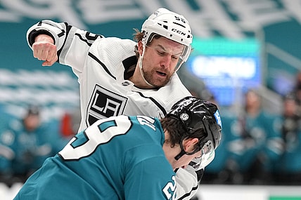 Mar 22, 2021; San Jose, California, USA;  Los Angeles Kings defenseman Kurtis MacDermid (56) fights against San Jose Sharks right wing Kurtis Gabriel (29) during the first period at SAP Center at San Jose. Mandatory Credit: Stan Szeto-USA TODAY Sports