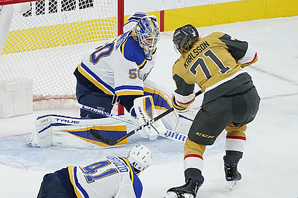 Mar 22, 2021; Las Vegas, Nevada, USA; Vegas Golden Knights center William Karlsson (71) scores against St. Louis Blues goaltender Jordan Binnington (50) during the third period at T-Mobile Arena. Mandatory Credit: John Locher /POOL PHOTOS-USA TODAY Sports