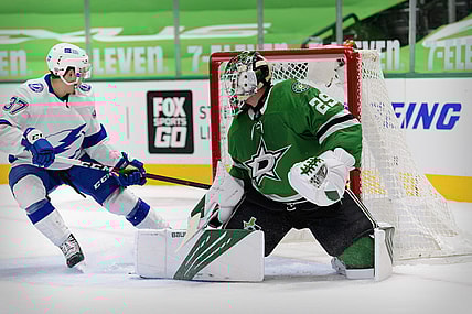 Mar 25, 2021; Dallas, Texas, USA; Dallas Stars goaltender Jake Oettinger (29) turns away a shot by Tampa Bay Lightning center Yanni Gourde (37) during the first period at the American Airlines Center. Mandatory Credit: Jerome Miron-USA TODAY Sports