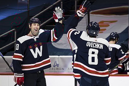 Mar 26, 2021; Washington, District of Columbia, USA; Washington Capitals defenseman Zdeno Chara (33) celebrates with left wing Alex Ovechkin (8) after the game against the New Jersey Devils at Capital One Arena. Mandatory Credit: Scott Taetsch-USA TODAY Sports