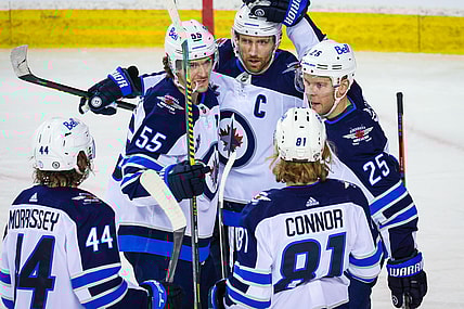 Mar 26, 2021; Calgary, Alberta, CAN; Winnipeg Jets center Paul Stastny (25) celebrates his goal with his teammates against the Calgary Flames during the third period at Scotiabank Saddledome. Mandatory Credit: Sergei Belski-USA TODAY Sports