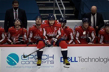 Mar 25, 2021; Washington, District of Columbia, USA; Washington Capitals left wing Alex Ovechkin (8) sits on the boards during a break in the first period of the game against the New Jersey Devils at Capital One Arena. Mandatory Credit: Scott Taetsch-USA TODAY Sports