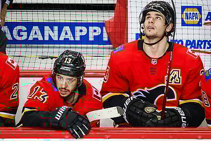 Mar 17, 2021; Calgary, Alberta, CAN; Calgary Flames left wing Johnny Gaudreau (13) and center Sean Monahan (23) on their bench against the Edmonton Oilers during the third period at Scotiabank Saddledome. Mandatory Credit: Sergei Belski-USA TODAY Sports