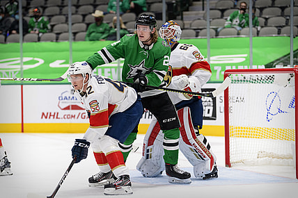 Mar 28, 2021; Dallas, Texas, USA; Florida Panthers goaltender Chris Driedger (60) and defenseman Gustav Forsling (42) defend against Dallas Stars left wing Roope Hintz (24) during the second period at the American Airlines Center. Mandatory Credit: Jerome Miron-USA TODAY Sports