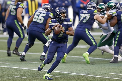 Dec 13, 2020; Seattle, Washington, USA; Seattle Seahawks quarterback Geno Smith (7) passes against the New York Jets during the fourth quarter at Lumen Field. Mandatory Credit: Joe Nicholson-USA TODAY Sports