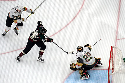 Jan 24, 2021; Glendale, Arizona, USA; Vegas Golden Knights goaltender Marc-Andre Fleury (29) makes a save against Arizona Coyotes right wing Christian Fischer (36) during the third period at Gila River Arena. Mandatory Credit: Joe Camporeale-USA TODAY Sports