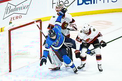 Feb 13, 2021; Winnipeg, Manitoba, CAN;  Ottawa Senators defenseman Christian Wolanin (24) hits Winnipeg Jets forward Blake Wheeler (26) in front of Ottawa Senators goalie Marcus Hogberg (1) during the third period at Bell MTS Place. Mandatory Credit: Terrence Lee-USA TODAY Sports