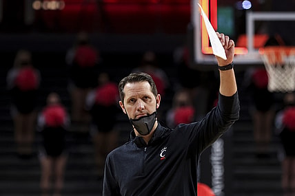 Feb 14, 2021; Cincinnati, Ohio, USA; Cincinnati Bearcats head coach John Brannen reacts to fans after defeating the UCF Knights at Fifth Third Arena. Mandatory Credit: Aaron Doster-USA TODAY Sports