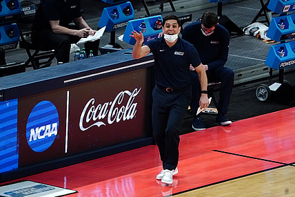 Mar 20, 2021; Indianapolis, Indiana, USA; UNCG Spartans head coach Wes Miller (C) gestures during the first half against the Florida State Seminoles in the first round of the 2021 NCAA Tournament at Bankers Life Fieldhouse. Mandatory Credit: Kirby Lee-USA TODAY Sports