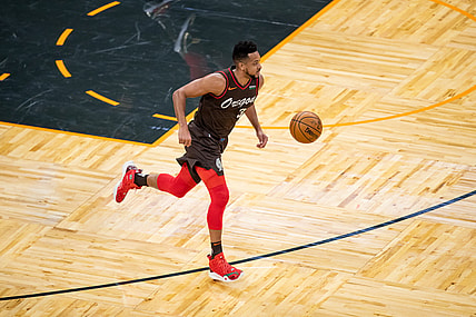 Mar 26, 2021; Orlando, Florida, USA; Portland Trail Blazers guard CJ McCollum (3) dribbles against the Orlando Magic during the first quarter at Amway Center. Mandatory Credit: Mary Holt-USA TODAY Sports