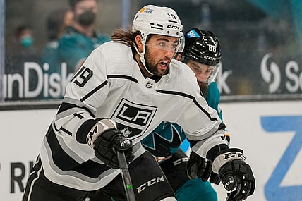 Mar 24, 2021; San Jose, California, USA;  Los Angeles Kings right wing Alex Iafallo (19) chases after the puck during the first period against the San Jose Sharks at SAP Center at San Jose. Mandatory Credit: Stan Szeto-USA TODAY Sports