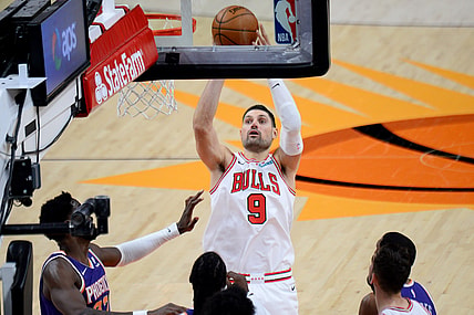 Mar 31, 2021; Phoenix, Arizona, USA; Chicago Bulls center Nikola Vucevic (9) shoots against the Phoenix Suns during the second half at Phoenix Suns Arena. Mandatory Credit: Joe Camporeale-USA TODAY Sports