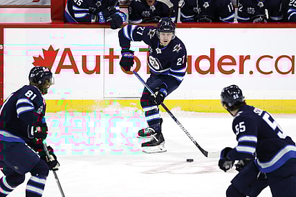 Apr 2, 2021; Winnipeg, Manitoba, CAN;  Winnipeg Jets left wing Nikolaj Ehlers (27) skates up the ice with teammates Winnipeg Jets left wing Kyle Connor (81) and Winnipeg Jets center Mark Scheifele (55) in the first period against the Toronto Maple Leafs at Bell MTS Place. Mandatory Credit: James Carey Lauder-USA TODAY Sports