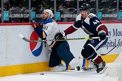 Apr 2, 2021; Denver, Colorado, USA; Colorado Avalanche left wing Kiefer Sherwood (44) checks St. Louis Blues defenseman Robert Bortuzzo (41) in the third period at Ball Arena. Mandatory Credit: Isaiah J. Downing-USA TODAY Sports