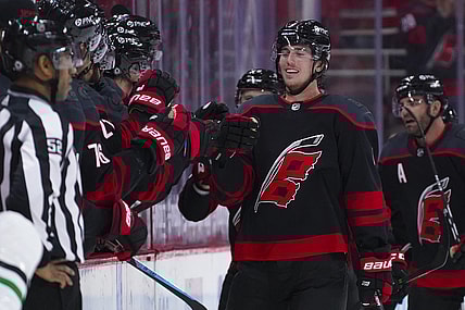 Apr 3, 2021; Raleigh, North Carolina, USA;  Carolina Hurricanes defenseman Haydn Fleury (4) celebrates after scoring a second period goal against the Dallas Stars at PNC Arena. Mandatory Credit: James Guillory-USA TODAY Sports