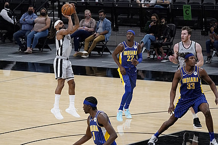 Apr 3, 2021; San Antonio, Texas, USA; San Antonio Spurs guard Patty Mills (8) shoots a three pointer as Indiana Pacers guard Caris LeVert (22) looks on in the second quarter at AT&T Center. Mandatory Credit: Scott Wachter-USA TODAY Sports