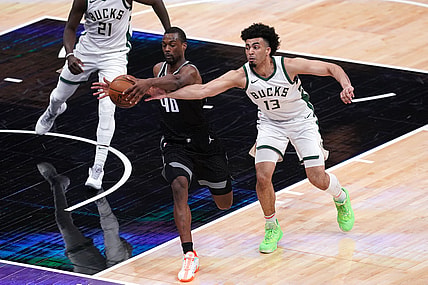 Apr 3, 2021; Sacramento, California, USA; Sacramento Kings forward Harrison Barnes (40) and Milwaukee Bucks forward Jordan Nwora (13) battle for a rebound in the second quarter at the Golden 1 Center. Mandatory Credit: Cary Edmondson-USA TODAY Sports