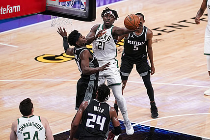 Apr 3, 2021; Sacramento, California, USA; Milwaukee Bucks guard Jrue Holiday (21) drives to the basket against the Sacramento Kings in the fourth quarter at the Golden 1 Center. Mandatory Credit: Cary Edmondson-USA TODAY Sports