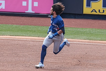 Apr 4, 2021; Bronx, New York, USA; Toronto Blue Jays shortstop Bo Bichette (11) runs to second base after hitting a double during the first inning against the New York Yankees at Yankee Stadium. Mandatory Credit: Vincent Carchietta-USA TODAY Sports