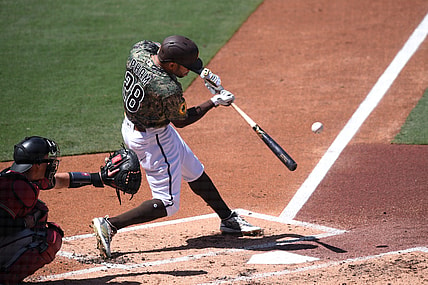 Apr 4, 2021; San Diego, California, USA; San Diego Padres center fielder Tommy Pham (28) singles against the Arizona Diamondbacks during the second inning at Petco Park. Mandatory Credit: Orlando Ramirez-USA TODAY Sports