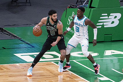 Apr 4, 2021; Boston, Massachusetts, USA;  Boston Celtics power forward Jayson Tatum (0) dribbles the ball against Charlotte Hornets shooting guard Terry Rozier (3) defending during the first quarter at TD Garden. Mandatory Credit: Gregory Fisher-USA TODAY Sports
